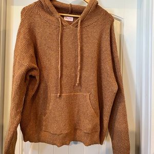 Size medium, camel colored front pocket hooded sweater. Super cute!